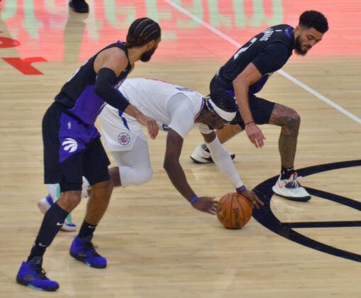 Los Angeles Clippers guard Regggie Jackson (1) steals the ball from Toronto Raptors guard Jalen Harris (2) during the second half at Staples Center in Los Angeles on Tuesday, May 4, 2021. The Clippers defeated the Raptors 105-100 to end a three-game losing streak.  LAP2021050410 JIMxRUYMEN
