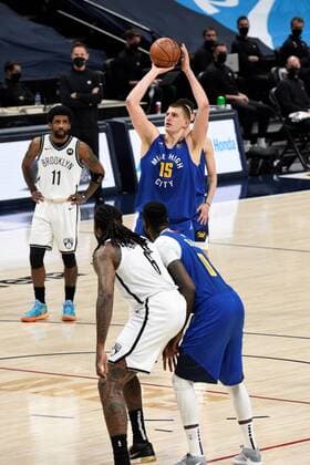 Denver Nuggets center Nikola Jokic 15, (CR) shoots a free throw as Brooklyn Nets center DeAndre Jordan 6 (CR) and Denver Nuggets forward JaMychal Green 0 (R), and Brooklyn Nets guard Kyrie Irving 11 (L), look on during the second quarter at the Ball Arena in Denver, CO, USA, 08 May 2021. Denver Nuggets - Brooklyn Nets !ACHTUNG: NUR REDAKTIONELLE NUTZUNG!  Copyright: xToddxPiersonx AME6322 20210509-637561367435129352