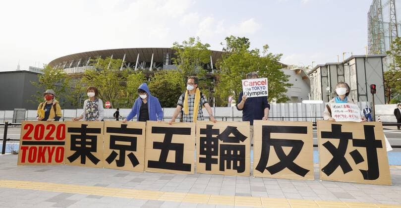 Protest against Tokyo Olympics People protest against holding the Tokyo Olympics amid the coronavirus pandemic, near National Stadium in Tokyo on May 9, 2021, as an Olympic test event for athletics is held inside the venue. 