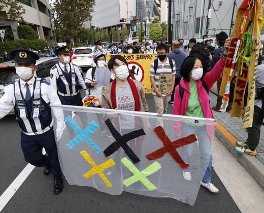 Protest against Tokyo Olympics People protest around National Stadium in Tokyo on May 9, 2021, against holding the Tokyo Olympics amid the coronavirus pandemic, as an Olympic test event for athletics is held inside the stadium. 