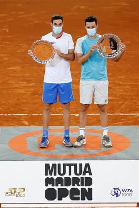 Marcel Granollers of Spain (L) and Horacio Zeballos (R) of Argentina pose with their trophies after winning the men s double final against Mate Pavic and Nikola Mektic of Croatia at the Mutua Madrid Open tennis tou?rnament in Madrid, Spain, 09 May 2021. Mutua Madrid Open tennis tou?rnament !ACHTUNG: NUR REDAKTIONELLE NUTZUNG!  Copyright: xChemaxMoyax GRAF3339 20210509-637561771233161638