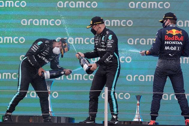 British driver Lewis Hamilton (L) of Mercedes celebrates his victory with his team mate, Finnish Valtteri Bottas (C), who ended third and Dutch Max Verstappen (R) of Red Bull at the podium of the Spain s Formula One Grand Prix at Barcelona-Catalunya racetrack in Montmelo, Barcelona, nort-eastern Spain, 09 May 2021. Spain s Formula One Grand Prix !ACHTUNG: NUR REDAKTIONELLE NUTZUNG!  Copyright: xAlejandroxGarcíax GRAFCAT2950 20210509-637561790626268217