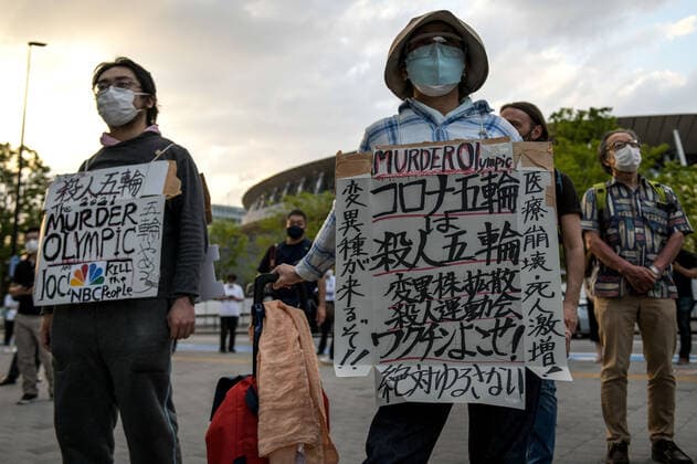May 9, 2021, Tokyo, Japan: Protesters carry placards as they demonstrate against the Tokyo Olympics in front of the New National Stadium, the main stadium for the Tokyo Olympics..With less than 3 months remaining until the opening of the Tokyo 2020 Olympics concern continues to linger in Japan over the feasibility of hosting such a huge event during the ongoing COVID-19 pandemic. Tokyo Japan - ZUMAs197 0117369341st Copyright: xCezaryxKowalskix