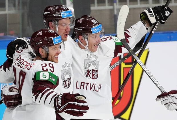 RIGA, LATVIA - MAY 21, 2021: Latviaâ€™s players celebrate a goal in their 2021 IIHF World Championship, WM, Weltmeisterschaft Group A Ice hockey, Eishockey match against Canada at Arena Riga. Natalia Fedosenko TASS  TS100E33