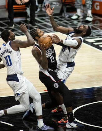 May 22, 2021, Los Angeles, California, USA: Tim Hardaway Jr. 11 of the Dallas Mavericks is fouled by Paul George 13 of the Los Angeles Clippers as he goes up for a shot during Game One of the Western Conference First Round game on Saturday May 22, 2021 at the Staples Center in Los Angeles, California. Clippers lose to Mavericks, 103-113. PI Los Angeles USA - ZUMAp124 20210522_zaa_p124_030 Copyright: xJAVIERxROJASx