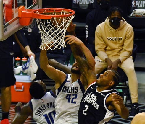 Los Angeles Clippers forward Kawhi Leonard (2) fouls Dallas Maverick s forward Maxi Kleber (42) during the second half of their best-of-seven playoff series opener at Staples Center in Los Angeles on Saturday, May 22, 2021. The Mavericks defeated the Clippers 113-103.  LAP2021052228 JIMxRUYMEN