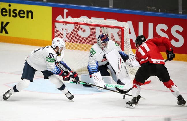 RIGA, LATVIA - MAY 23, 2021: The USA s Christian Wolanin, goalie Jake Oettinger and Canada s Jaret Anderson-Dolan (L-R) in action in their 2021 IIHF World Championship, WM, Weltmeisterschaft Group B Ice hockey, Eishockey match at Arena Riga. Natalia Fedosenko TASS  TS101149