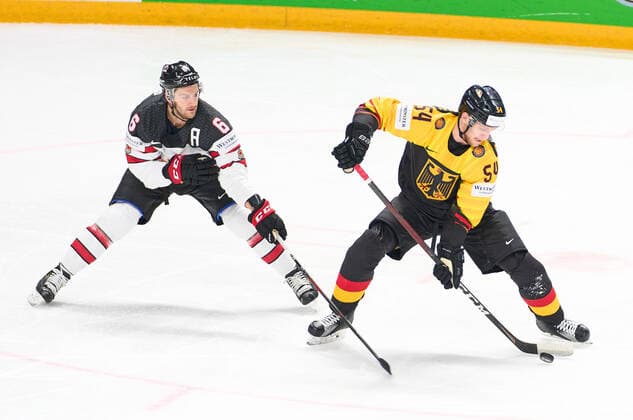 Lean BERGMANN 54 of Germany compete, fight for the puck against Colin Miller 6 of Canada GERMANY - CANADA IIHF Ice hockey, Eishockey WORLD CHAMPIONSHIPS Group B in Riga, Latvia, Lettland, May 24, 2021, Season 2020 2021