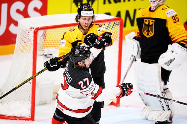 210524 Moritz Seider of Germany against Michael Bunting of Canada during the 2021 IIHF Ice Hockey World Championship game between Germany and Canada on May 24, 2021 in Riga Photo Simon Hastegard BILDBYRAN kod SH SH0113 ishockey ice hockey ishockey vm iihf ice hockey world championship germany tyskland canada kanada day 4 bbeng,  Copyright: SIMONxHASTEGARD BB210524SH048