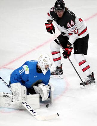 Eishockey, WM, Kanada - Kasachstan RIGA, LATVIA â€“ MAY 28, 2021: Kazakhstan s goaltender Andre Shutov (L) defends against Canada s Max Comtois in their 2021 IIHF Ice hockey, Eishockey World Championship, WM, Weltmeisterschaft Preliminary Round Group B match, at the Arena Riga. Natalia Fedosenko TASS  TS101DAB
