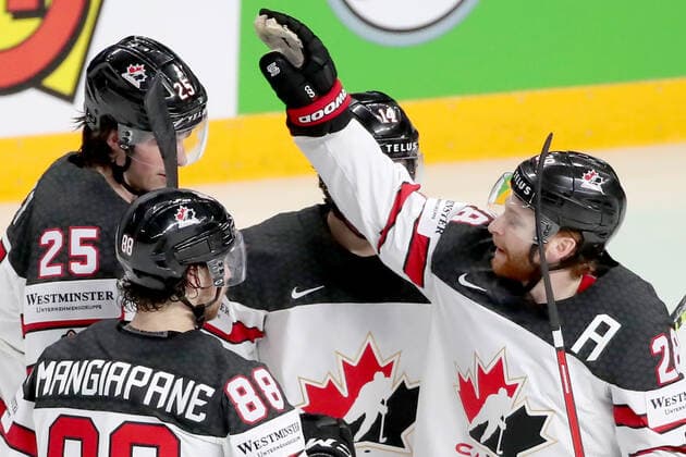 RIGA, LATVIA â€“ MAY 28, 2021: Canada s Owen Power, Andrew Mangiapane, Adam Henrique, and Connor Brown (L-R) celebrate scoring in their 2021 IIHF Ice hockey, Eishockey World Championship, WM, Weltmeisterschaft Preliminary Round Group B match against Kazakhstan, at the Arena Riga. Natalia Fedosenko TASS  TS101E29