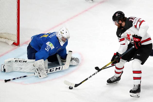 RIGA, LATVIA â€“ MAY 28, 2021: Kazakhstan s goaltender Andrei Shutov (L) defends against Canada s Gabriel Vilardi in their 2021 IIHF Ice hockey, Eishockey World Championship, WM, Weltmeisterschaft Preliminary Round Group B match, at the Arena Riga. Natalia Fedosenko TASS  TS101EF9