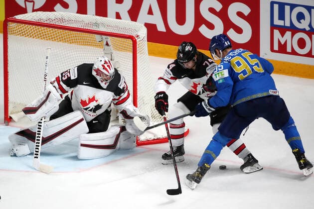 RIGA, LATVIA â€“ MAY 28, 2021: Canada s goaltender Darcy Kuemper, Nicolas Beaudin defend against Kazakhstan s Dmitry Shevchenko (L-R) in their 2021 IIHF Ice hockey, Eishockey World Championship, WM, Weltmeisterschaft Preliminary Round Group B match, at the Arena Riga. Natalia Fedosenko TASS  TS101EFA