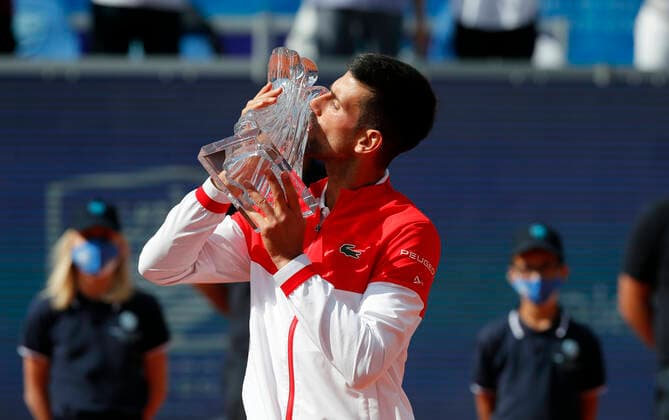 (210530) -- BELGRADE, May 30, 2021 -- Serbia s Novak Djokovic kisses the trophy during the awarding ceremony after the ATP, Tennis Herren 250 Belgrade Open singles final between Serbia s Novak Djokovic and Slovakia s Alex Molcan in Belgrade, Serbia on May 29, 2021. (Photo by Xinhua) (SP)SERBIA-BELGRADE-TENNIS-ATP BELGRADE OPEN-FINAL PredragxMilosavljevic 