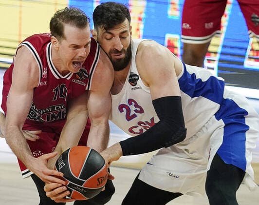 COLOGNE, GERMANY - MAY 30, 2021: Olimpia s Michael Roll (L) and CSKA s Tornike Shengelia in action in the 2020 21 Euroleague Final Four third place game between AX Armani Exchange Milan and CSKA Moscow at Lanxess Arena. Tatyana Makeyeva TASS  TS102252