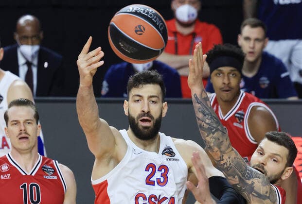COLOGNE, GERMANY - MAY 30, 2021: Olimpia s Michael Roll (L) and CSKA s Tornike Shengelia in action in the 2020 21 Euroleague Final Four third place game between AX Armani Exchange Milan and CSKA Moscow at Lanxess Arena. Tatyana Makeyeva TASS  TS10227A