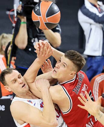 COLOGNE, GERMANY - MAY 30, 2021: CSKA s Johannes Voigtmann (L) and Olimpia s Kaleb Tarczewski in action in the 2020 21 Euroleague Final Four third place game between AX Armani Exchange Milan and CSKA Moscow at Lanxess Arena. Tatyana Makeyeva TASS  TS10227C