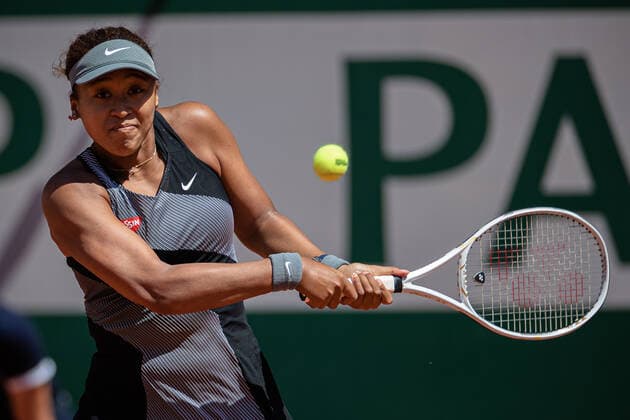 (210531) -- PARIS, May 31, 2021 -- Osaka Naomi of Japan returns the ball during the women s singles first round match against Patricia Maria Tig of Romania at the French Open tennis tournament at Roland Garros in Paris, France, May 30, 2021. (Photo by Aurelien Morissard Xinhua) (SP)FRANCE-PARIS-TENNIS-ROLAND GARROS-FRENCH OPEN-WOMEN S SINGLES AoxLeilian¡¤molisaer 