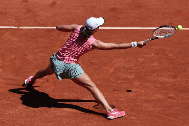 (210531) -- PARIS, May 31, 2021 -- Iga Swiatek of Poland hits a return during the women s singles first round match between Kaja Juvan of Slovenia and Iga Swiatek of Poland at the French Open tennis tournament at Roland Garros in Paris, France, May 31, 2021. ) (SP)FRANCE-PARIS-TENNIS-ROLAND GARROS-FRENCH OPEN-WOMEN S SINGLES GaoxJing 