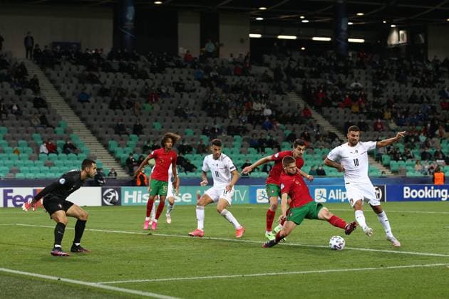 Ljubljana, Slovenia, 31st May 2021. Patrick Cutrone of Italy anticipates Diogo Queiros of Portugal to score past Diogo Costa of Portugal and level the game at 3-3 during the UEFA U21, U 21 Championships 2021 match at Stadion Stoczicw, Ljubljana. Picture credit should read: Jonathan Moscrop Sportimage EDITORIAL USE ONLY. No use with unauthorised audio, video, data, fixture lists, club league logos or live services. Online in-match use limited to 120 images, no video emulation. No use in betting, games or single club league player publications. SPI-1070-0020