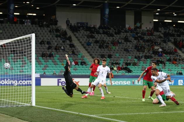 Ljubljana, Slovenia, 31st May 2021. Patrick Cutrone of Italy anticipates Diogo Queiros of Portugal to score past Diogo Costa of Portugal and level the game at 3-3 during the UEFA U21, U 21 Championships 2021 match at Stadion Stoczicw, Ljubljana. Picture credit should read: Jonathan Moscrop Sportimage EDITORIAL USE ONLY. No use with unauthorised audio, video, data, fixture lists, club league logos or live services. Online in-match use limited to 120 images, no video emulation. No use in betting, games or single club league player publications. SPI-1070-0024