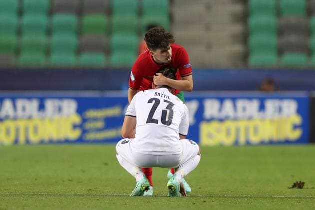 Ljubljana, Slovenia, 31st May 2021. Vitinha of Portugal consulates Riccardo Sottil of Italy as he reacts after Francisco Conceicao of Portugal scored to give the side a 5-3 extra time lead during the UEFA U21, U 21 Championships 2021 match at Stadion Stoczicw, Ljubljana. Picture credit should read: Jonathan Moscrop Sportimage EDITORIAL USE ONLY. No use with unauthorised audio, video, data, fixture lists, club league logos or live services. Online in-match use limited to 120 images, no video emulation. No use in betting, games or single club league player publications. SPI-1070-0062