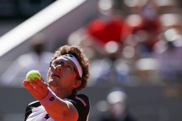 (210601) -- PARIS, June 1, 2021 -- Denis Istomin of Uzbekistan serves the ball during the men s singles first round match against Roger Federer of Switzerland at the French Open tennis tournament at Roland Garros in Paris, France, May 31, 2021. ) (SP)FRANCE-PARIS-TENNIS-ROLAND GARROS-FRENCH OPEN-MEN S SINGLES GaoxJing 