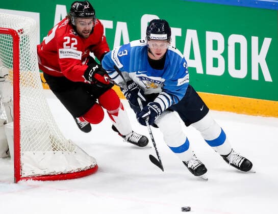 RIGA, LATVIA â€“ JUNE 1, 2021: Canada s Brandon Hagel (L) and Finland s Olli Maatta in their 2021 IIHF World Championship, WM, Weltmeisterschaft Group B Ice hockey, Eishockey match at Arena Riga. Natalia Fedosenko TASS  TS102556