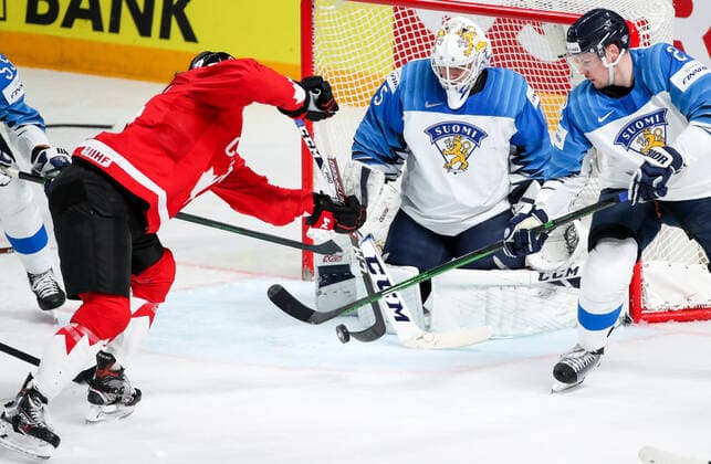 RIGA, LATVIA â€“ JUNE 1, 2021: Canada s Max Comtois scores a goal past Finland s Juho Olkinuora (L-R) in their 2021 IIHF World Championship, WM, Weltmeisterschaft Group B Ice hockey, Eishockey match at Arena Riga. Natalia Fedosenko TASS  TS102578