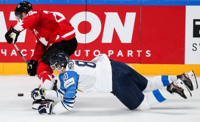 RIGA, LATVIA â€“ JUNE 1, 2021: Canada s Sean Walker (L) and Finland s Saku Maenalanen in their 2021 IIHF World Championship, WM, Weltmeisterschaft Group B Ice hockey, Eishockey match at Arena Riga. Natalia Fedosenko TASS  TS102588