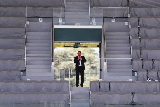 (210602) -- PARIS, June 2, 2021 -- A staff member is seen on the tribune during the men s singles first round match between Rafael Nadal of Spain and Alexei Popyrin of Australia at the French Open tennis tournament at Roland Garros in Paris, France, June 1, 2021. ) (SP)FRANCE-PARIS-TENNIS-ROLAND GARROS-FRENCH OPEN-MEN S SINGLES GaoxJing 