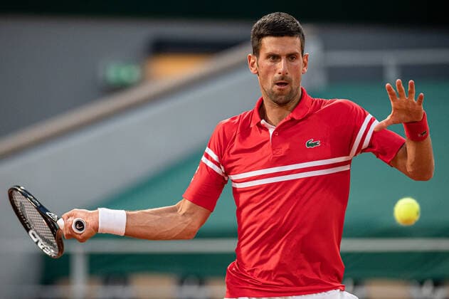 (210602) -- PARIS, June 2, 2021 -- Novak Djokovic of Serbia returns the ball during the first round match against Tennys Sandgren of USA at the French Open tennis tournament at Roland Garros in Paris, France, June 1, 2021. (Photo by Xinhua) (SP)FRANCE-PARIS-TENNIS-ROLAND GARROS-FRENCH OPEN-MEN S SINGLES AurelienxMorissard 