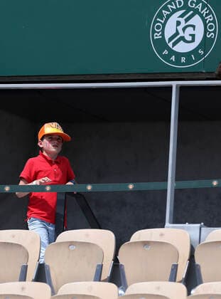 (210602) -- PARIS, June 2, 2021 -- A boy watches the men s singles second round match between Alexander Zverev of Germany and Roman Safiullin of Russia at the French Open tennis tournament at Roland Garros in Paris, France, June 2, 2021. ) (SP)FRANCE-PARIS-TENNIS-ROLAND GARROS-FRENCH OPEN-MEN S SINGLES-DAY 4 GaoxJing 