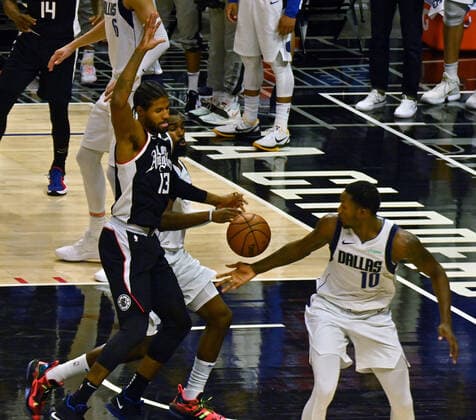 Dallas Mavericks forward Tim Hardaway Jr. pokes the ball away from Los Angeles Clippers guard Paul George (13) during the fourth quarter in Game 5 of their best-of-seven playoff series at Staples Center in Los Angeles on Wednesday, June 2, 2021. The Clippers lost to Dallas 105-100, their championship ambitions are hanging on for dear life trailing 3-2 in the series, with Game 6 coming on Friday in Dallas.  LAP2021060210 JIMxRUYMEN