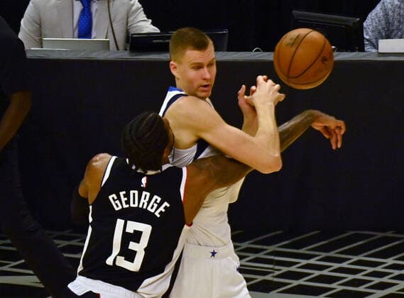 Los Angeles Clippers guard Paul George (13) fouls Dallas Mavericks guard Luka Doncic (77) during the fourth quarter in Game 5 of their best-of-seven playoff series at Staples Center in Los Angeles on Wednesday, June 2, 2021. The Clippers lost to Dallas 105-100, their championship ambitions are hanging on for dear life trailing 3-2 in the series, with Game 6 coming on Friday in Dallas.  LAP2021060212 JIMxRUYMEN