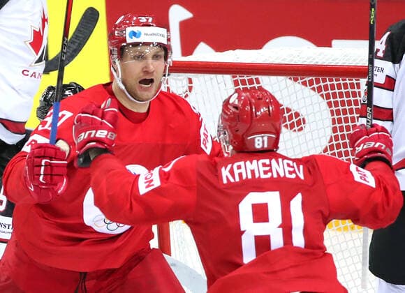 RIGA, LATVIA - JUNE 3, 2021: Russia s players celebrate a goal in a 2021 IIHF World Championship, WM, Weltmeisterschaft quarterfinal Ice hockey, Eishockey match against Canada at the Olympic Sports Center. Due to CAS sanctions, the Russian team performs under the name and flag of the Russian Olympic Committee (ROC). Natalia Fedosenko TASS  TS103346