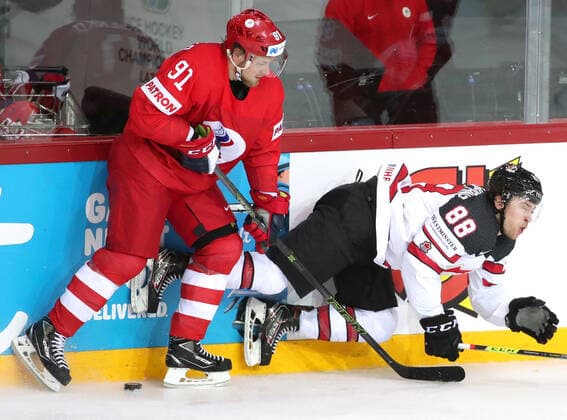 RIGA, LATVIA - JUNE 3, 2021: Russia s Vladimir Tarasenko (L) and Canada s Andrew Mangiapane fight for the puck in their 2021 IIHF World Championship, WM, Weltmeisterschaft quarterfinal Ice hockey, Eishockey match at the Olympic Sports Center. Due to CAS sanctions, the Russian team performs under the name and flag of the Russian Olympic Committee (ROC). Natalia Fedosenko TASS  TS103352