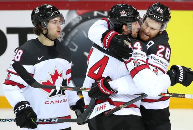 RIGA, LATVIA - JUNE 3, 2021: Canada s players celebrate a goal in a 2021 IIHF World Championship, WM, Weltmeisterschaft quarterfinal Ice hockey, Eishockey match against Russia at the Olympic Sports Center. Due to CAS sanctions, the Russian team performs under the name and flag of the Russian Olympic Committee (ROC). Natalia Fedosenko TASS  TS103353