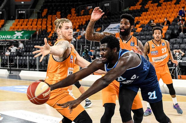 GER, BBL, Play offs, ratiopharm ulm vs Alba Berlin 03 06 2021, ratiopharm arena, Neu Ulm, GER, BBL, Play offs, ratiopharm ulm vs Alba Berlin, in picture Jean Marc Christ Koumadje Berlin, 21 gets the ball against Dylan Osetkowski Ulm, 21 and Cameron Clark Ulm, 3 , Troy Caupain Ulm, 23 in the background nordphotoxGmbHx xHafner nph00200