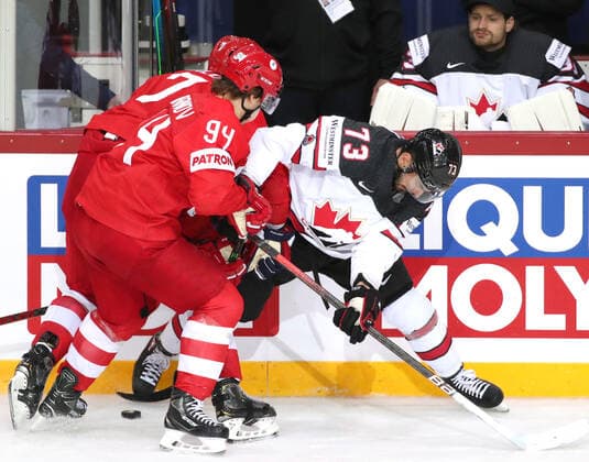 RIGA, LATVIA - JUNE 3, 2021: Russia s Alexander Barabanov (L) and Canada s Brandon Pirri fight for the puck in their 2021 IIHF World Championship, WM, Weltmeisterschaft quarterfinal Ice hockey, Eishockey match at the Olympic Sports Center. Due to CAS sanctions, the Russian team performs under the name and flag of the Russian Olympic Committee (ROC). Natalia Fedosenko TASS  TS1033AC