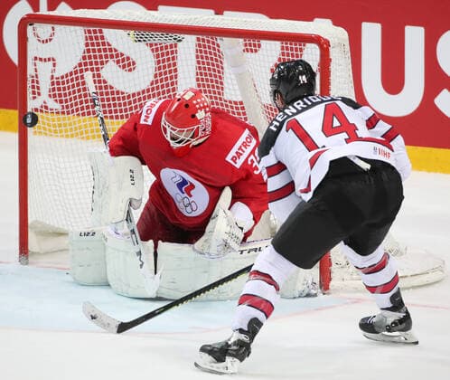 RIGA, LATVIA - JUNE 3, 2021: Russia s goalie Sergei Bobrovsky (L) defends against Canada s Adam Henrique in a 2021 IIHF World Championship, WM, Weltmeisterschaft quarterfinal Ice hockey, Eishockey match at the Olympic Sports Center. Due to CAS sanctions, the Russian team performs under the name and flag of the Russian Olympic Committee (ROC). Natalia Fedosenko TASS  TS1033AD