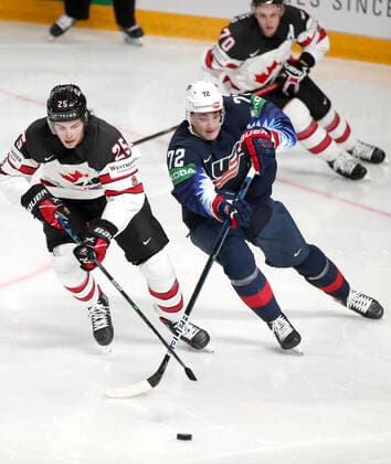 RIGA, LATVIA - JUNE 5, 2021: Owen Power (L) of Canada and Tage Thompson of the USA fight for the puck in their 2021 IIHF World Championship, WM, Weltmeisterschaft semifinal match at Arena Riga. Natalia Fedosenko TASS  TS103C31