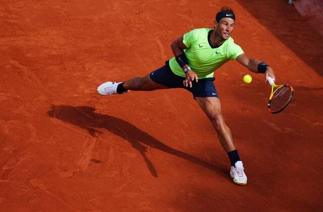 Mandatory Credit: Photo by Javier Garcia BPI Shutterstock (12019122ae) Rafael Nadal stretches for the ball French Open Tennis, Day Seven, Roland Garros, Paris, France - 05 Jun 2021 French Open Tennis, Day Seven, Roland Garros, Paris, France - 05 Jun 2021  Copyright: xJavierxGarcia BPI Shutterstockx 12019122ae
