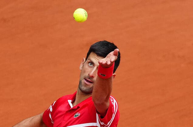 (210606) -- PARIS, June 6, 2021 -- Novak Djokovic serves during the men s singles third round match between Novak Djokovic of Serbia and Ricardas Berankis of Lithuania at the French Open tennis tournament at Roland Garros in Paris, France, June 5, 2021. ) (SP)FRANCE-PARIS-TENNIS-ROLAND GARROS-FRENCH OPEN-MEN S SINGLES GaoxJing 