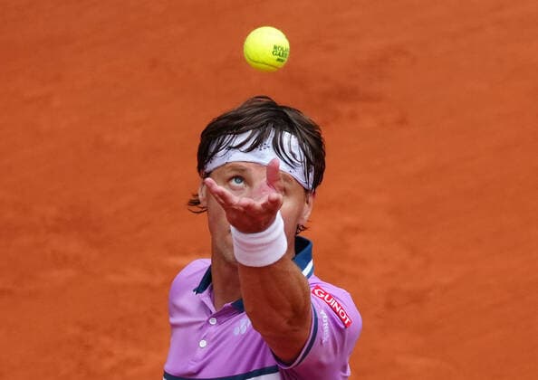 (210606) -- PARIS, June 6, 2021 -- Ricardas Berankis serves during the men s singles third round match between Novak Djokovic of Serbia and Ricardas Berankis of Lithuania at the French Open tennis tournament at Roland Garros in Paris, France, June 5, 2021. ) (SP)FRANCE-PARIS-TENNIS-ROLAND GARROS-FRENCH OPEN-MEN S SINGLES GaoxJing 