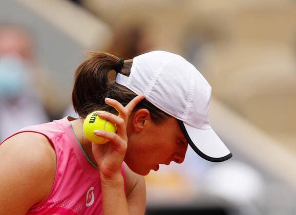 (210606) -- PARIS, June 6, 2021 -- Iga Swiatek of Poland reacts during the women s singles third round match between Iga Swiatek of Poland and Anett Kontaveit of Estonia at the French Open tennis tournament at Roland Garros in Paris, France, June 5, 2021. ) (SP)FRANCE-PARIS-TENNIS-ROLAND GARROS-FRENCH OPEN-WOMEN S SINGLES GaoxJing 