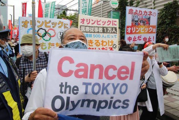 June 6, 2021, Tokyo, Japan - Protestors stage an anti government and anti Tokyo Olympics demonstration at downtown Shinjuku in Tokyo on Sunday, June 6, 2021. Hundreds of demonstrators marched from Shinjuku station to the Tokyo Metropolitan Government office. Noxthirdxpartyxsales  (0120535108st)