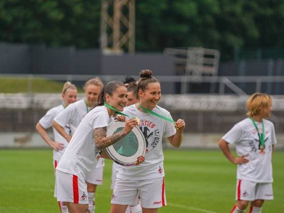Cologne, Germany, June 6th 2021: Francesca Calo (2 1. FC Koeln) and Sabrina Horvat (3 1. FC Koeln) after winning the 2. Womens Bundesliga South trophy at the Franz-Kremer-Stadium in Cologne, Germany. 2. Womens Bundesliga South - 1. FC K?ln v SG 99 Andernach 