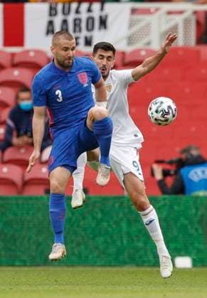 Middlesbrough, England, 6th June 2021. Luke Shaw of England challenges Andrei Ivan of Romania during the International Friendly, Länderspiel, Nationalmannschaft match at the Riverside Stadium, Middlesbrough. Picture credit should read: Darren Staples Sportimage EDITORIAL USE ONLY. No use with unauthorised audio, video, data, fixture lists, club league logos or live services. Online in-match use limited to 120 images, no video emulation. No use in betting, games or single club league player publications. SPI-1079-0023