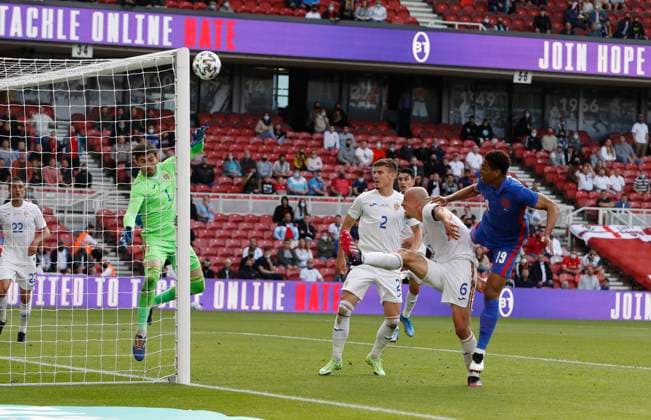 Middlesbrough, England, 6th June 2021. Vlad Chiriches of Romania diverts a header from Jude Bellingham of England over the bar during the International Friendly, Länderspiel, Nationalmannschaft match at the Riverside Stadium, Middlesbrough. Picture credit should read: Darren Staples Sportimage EDITORIAL USE ONLY. No use with unauthorised audio, video, data, fixture lists, club league logos or live services. Online in-match use limited to 120 images, no video emulation. No use in betting, games or single club league player publications. SPI-1079-0067